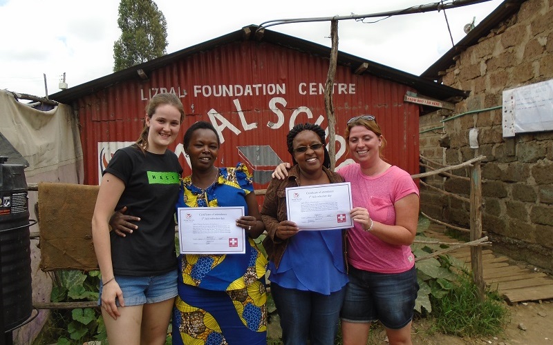 Mary, deputy head teacher of Excel, and Beth, head teacher of Lizpal, show their first aid certificates