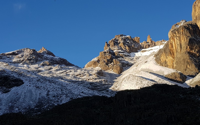 the top of mount kenya covered in snow, cold, stark and beautiful