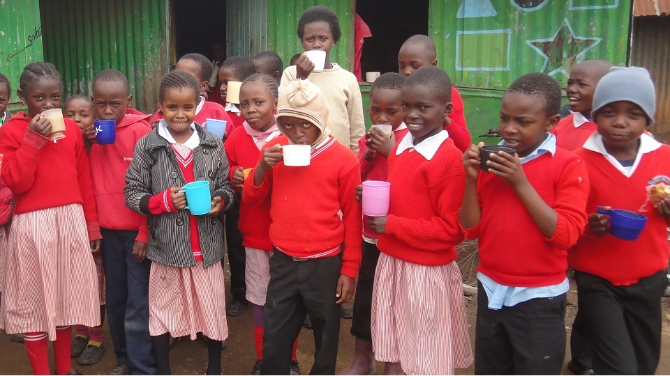 hot cups of Uji for breakfast at Excel school in the Nairobi slums